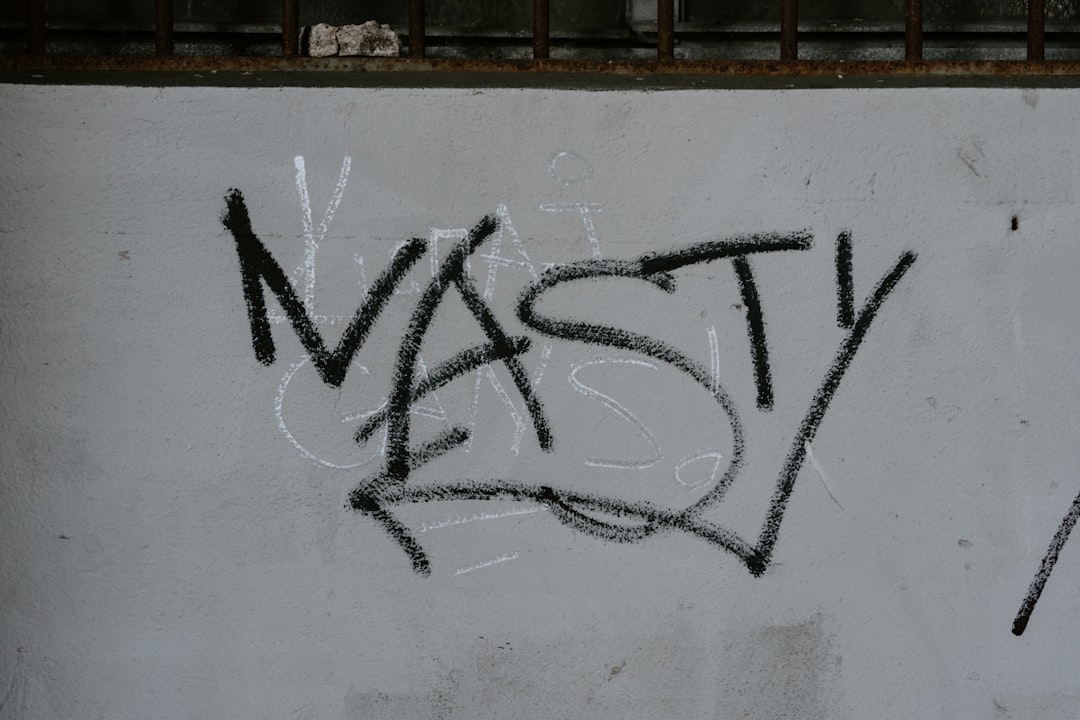 vandal on white painted wall