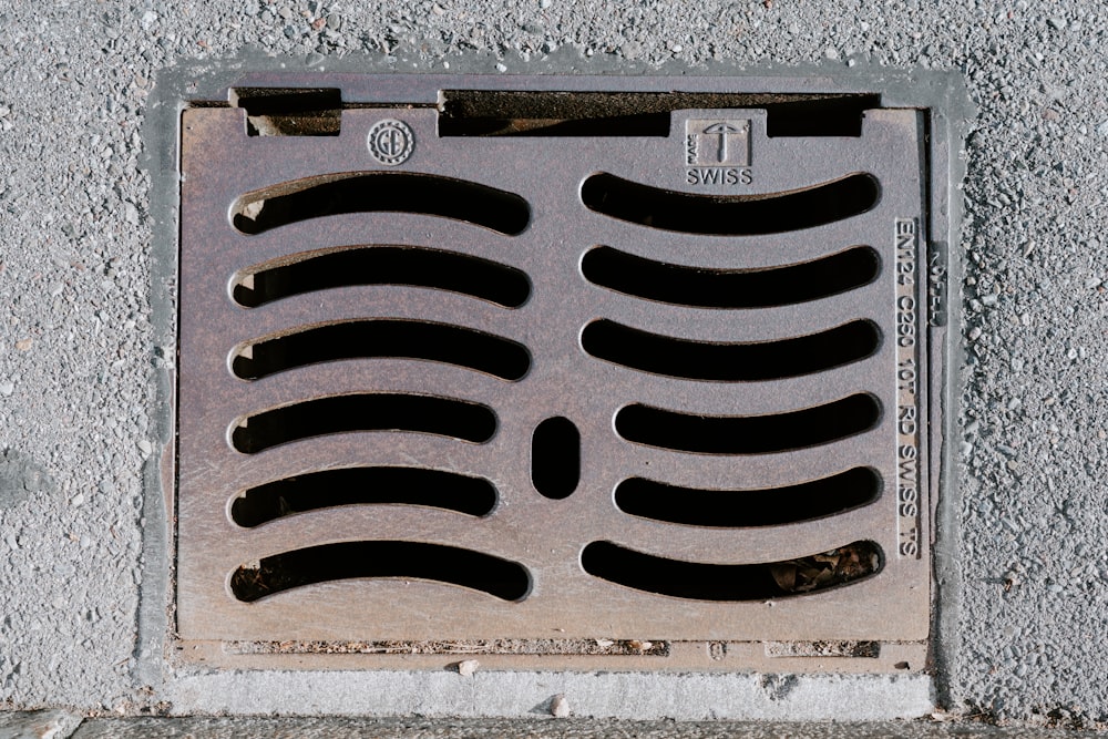 a manhole cover on the side of a building