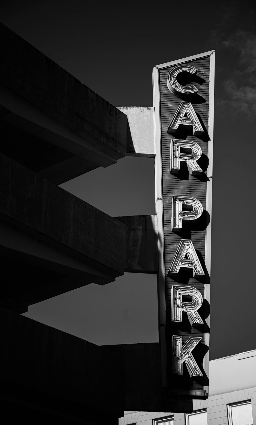 greyscale photography of car park signage