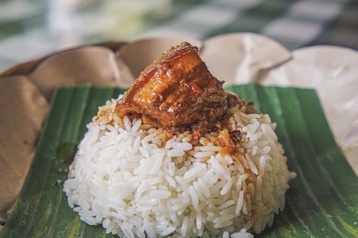 steamed rice with adobong pork on top