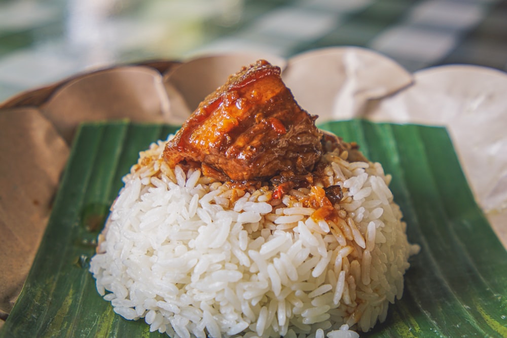 steamed rice with adobong pork on top