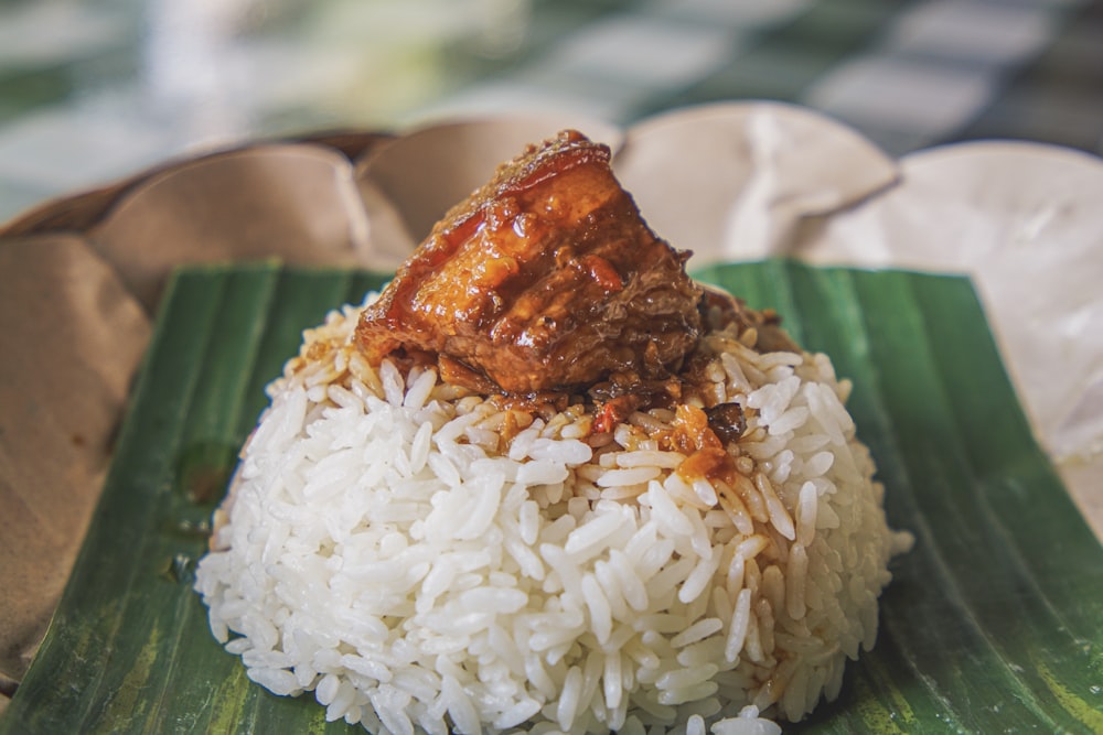 steamed rice with adobong pork on top