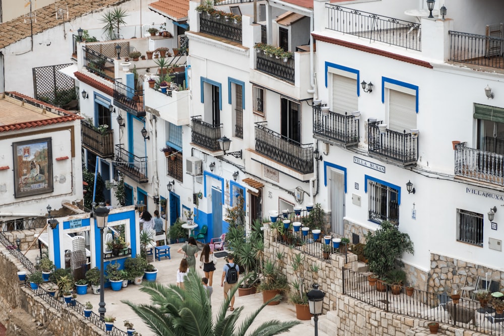 people beside buildings