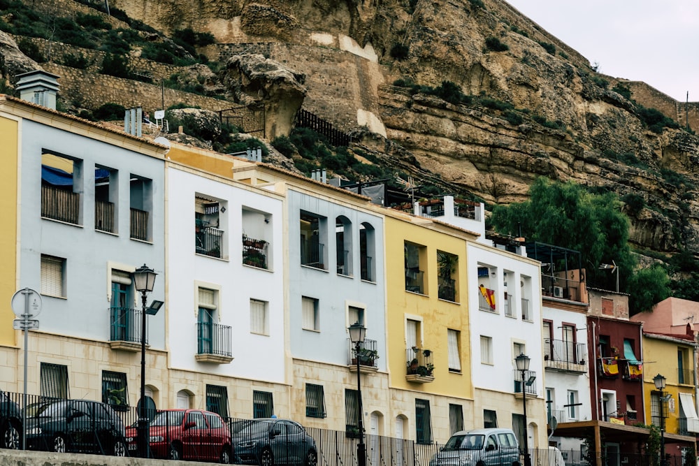 cars beside buildings during day