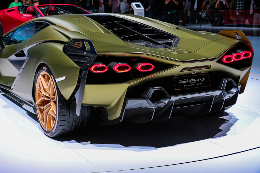 green Lamborghini sports car with taillights turned on