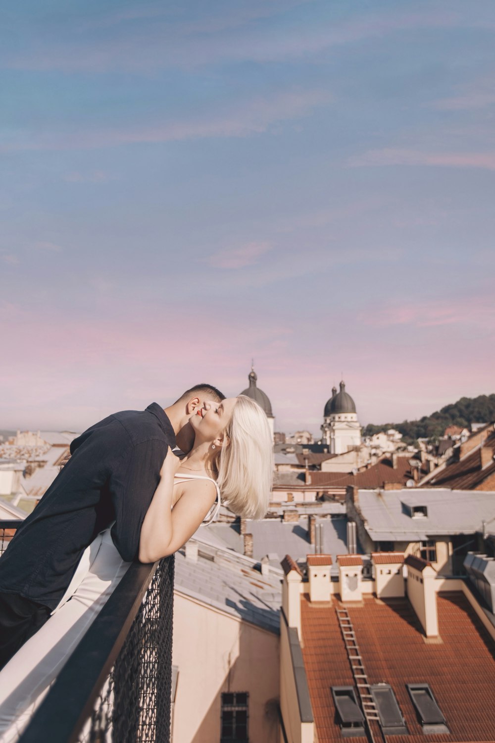 woman and man near houses