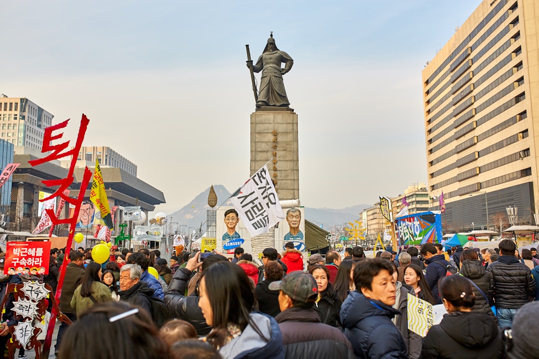 people near statue