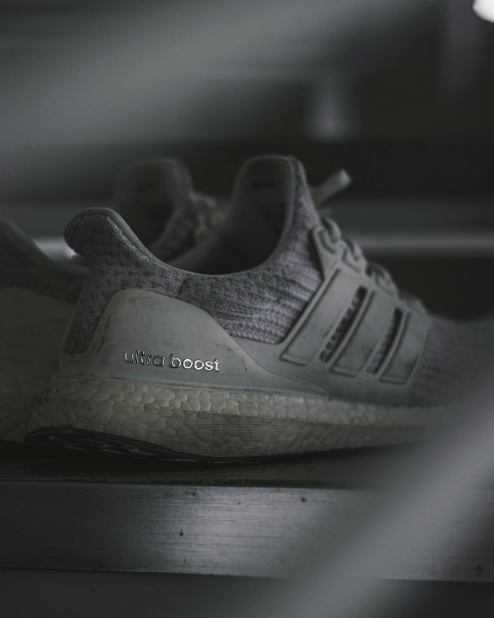 grayscale photo of Ultra Boost sneakers