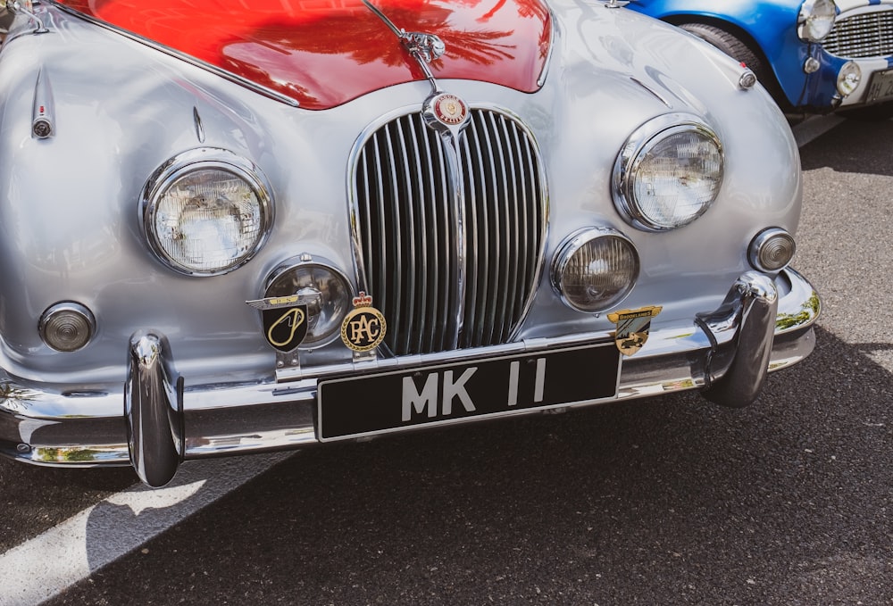 white and red Jaguar Mark 1 vehicle