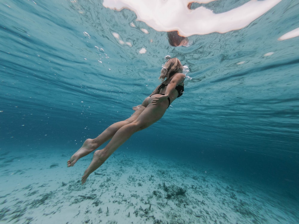 person diving in sea