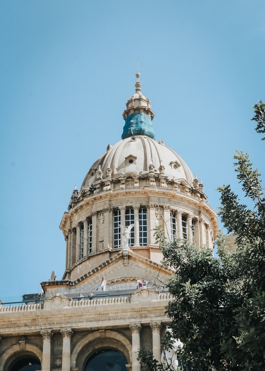 low-angle photography of cathedral under clear blue sky in Museu Nacional d'Art de Catalunya Spain