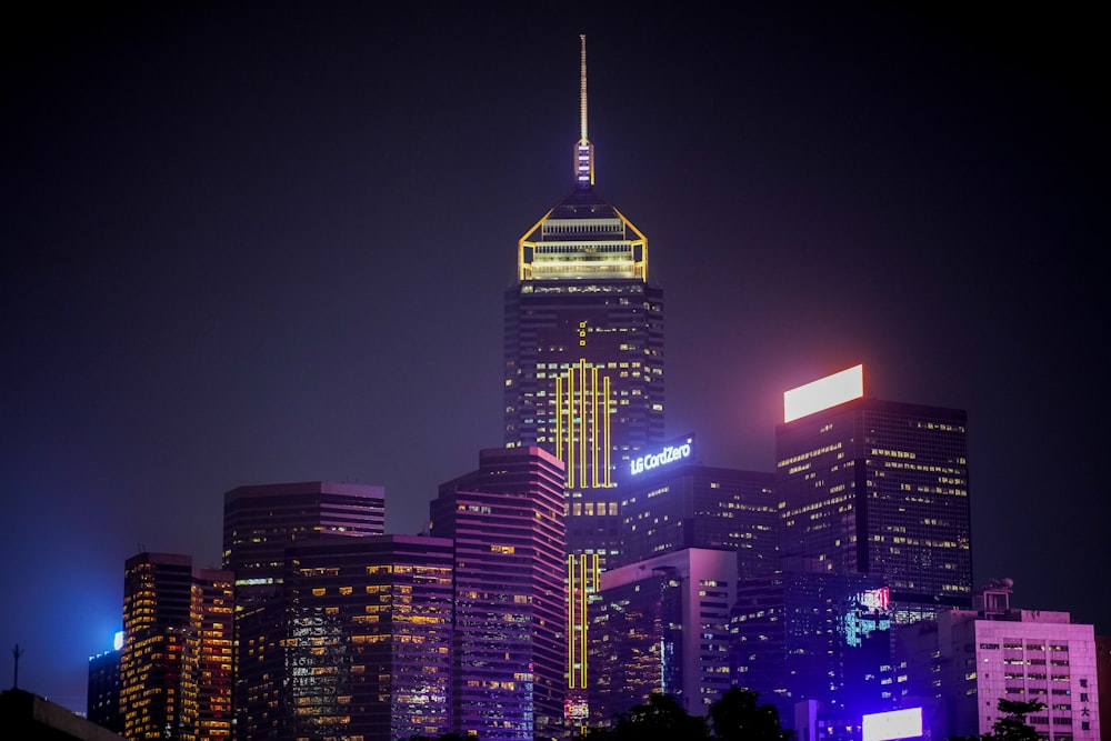 lighted concrete buildings during nighttime