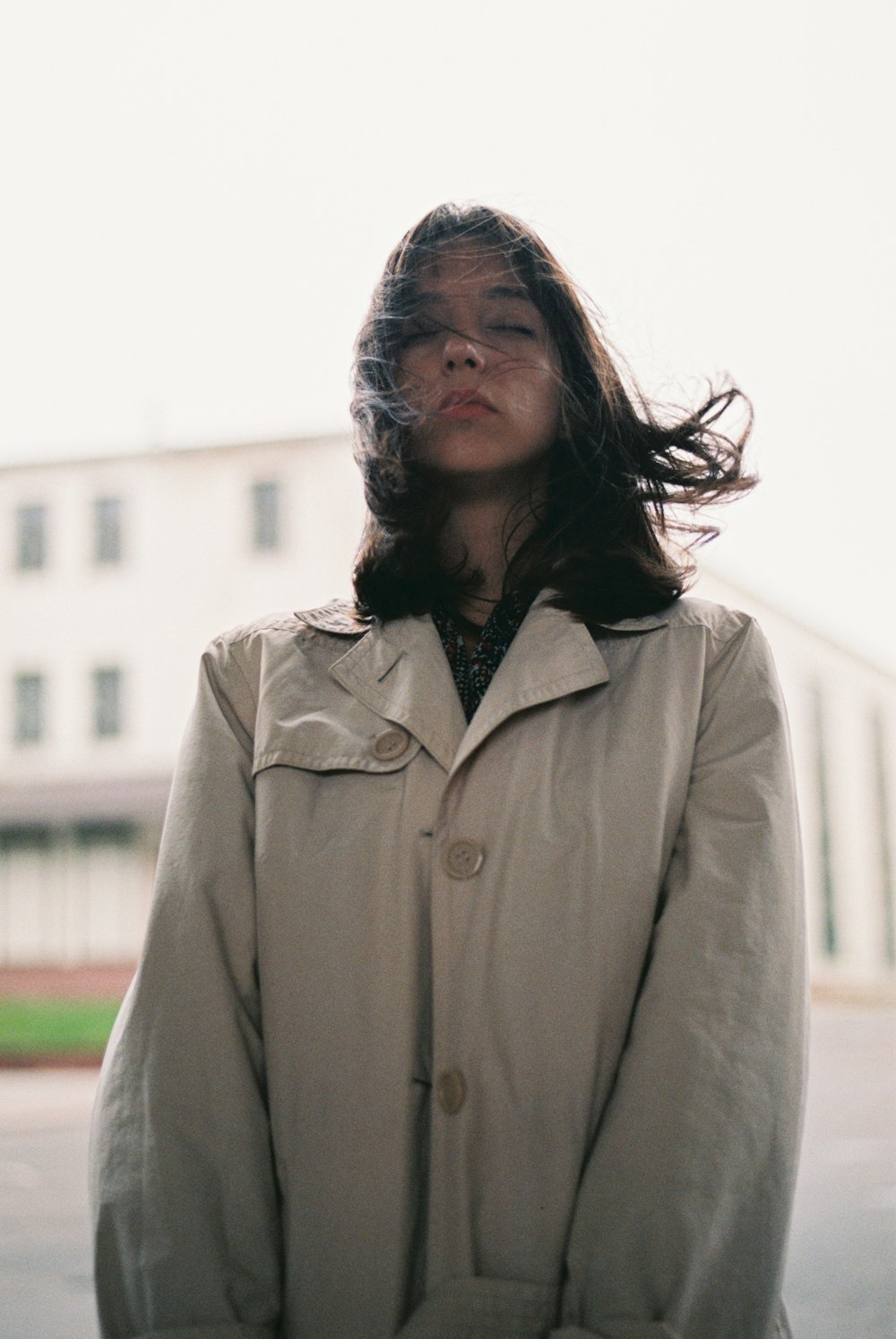 women's white coat close-up photography