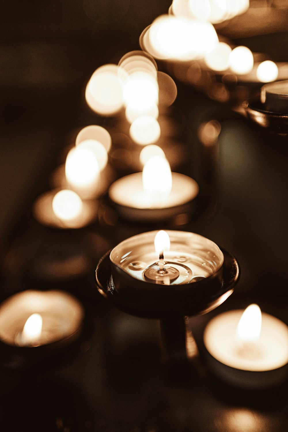 white scented candles close-up photography