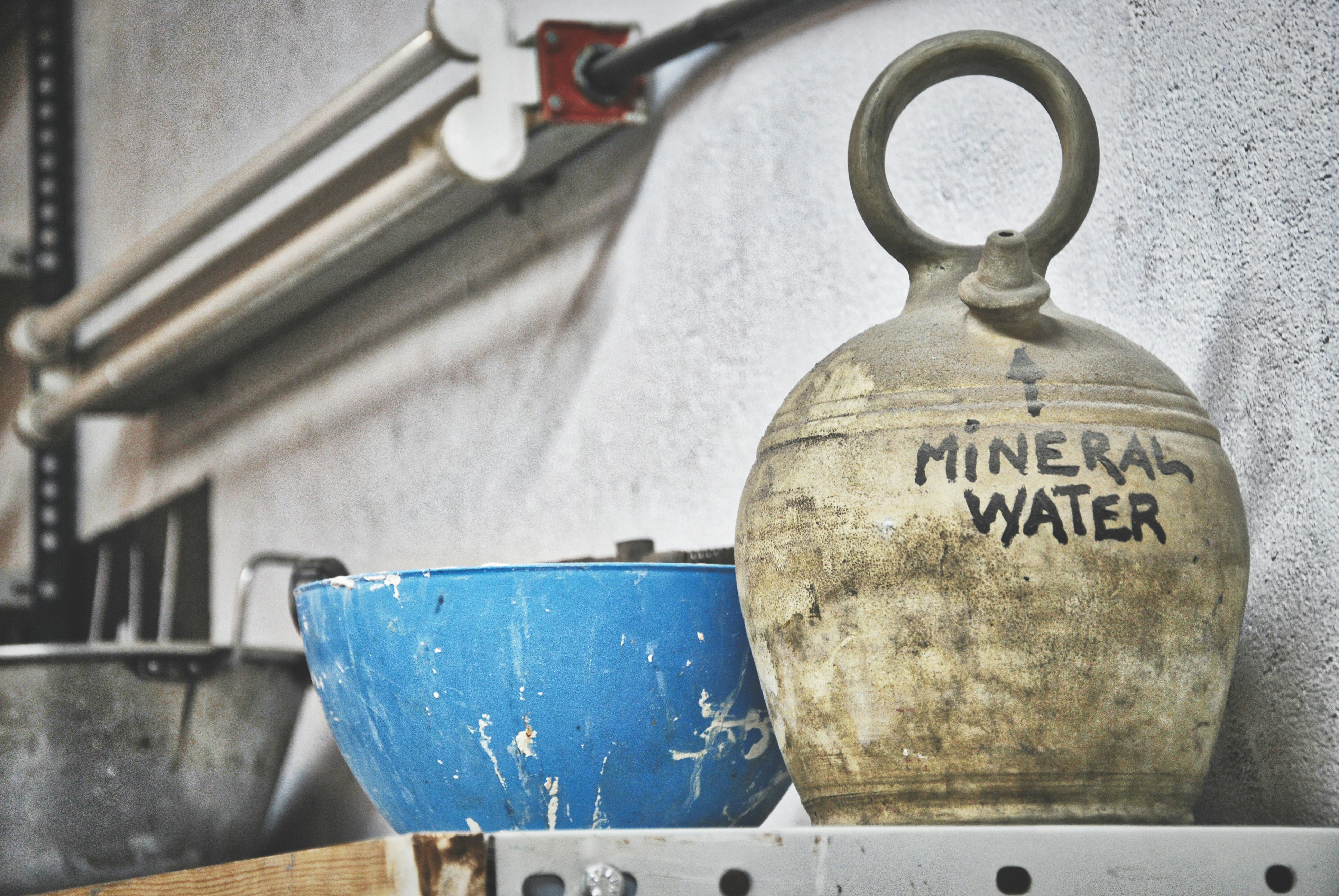 Blue bowl and white mineral water jug. La Tabacalera @ Lavapies. Madrid, Spain.