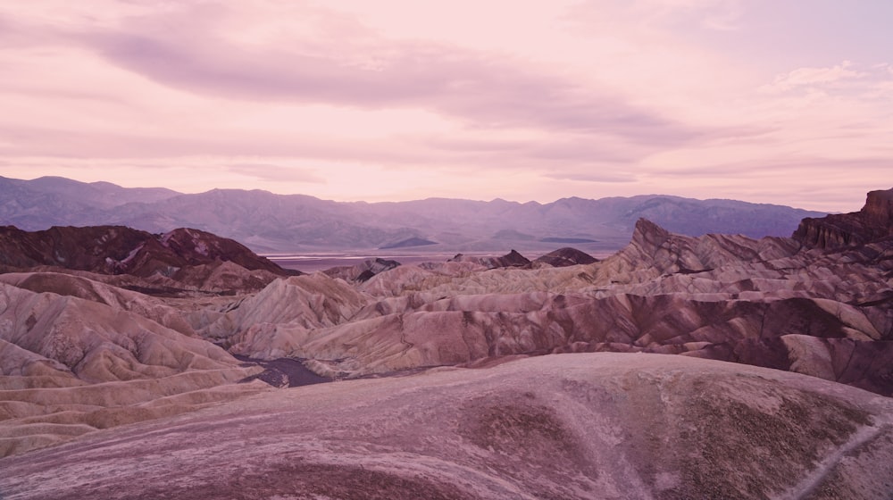 aerial photography of desert under white and gray sky during daytime