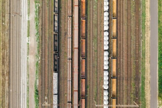 an aerial view of a train yard with several trains