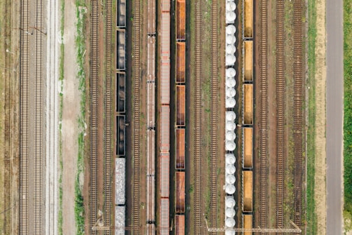 an aerial view of a train yard with several trains