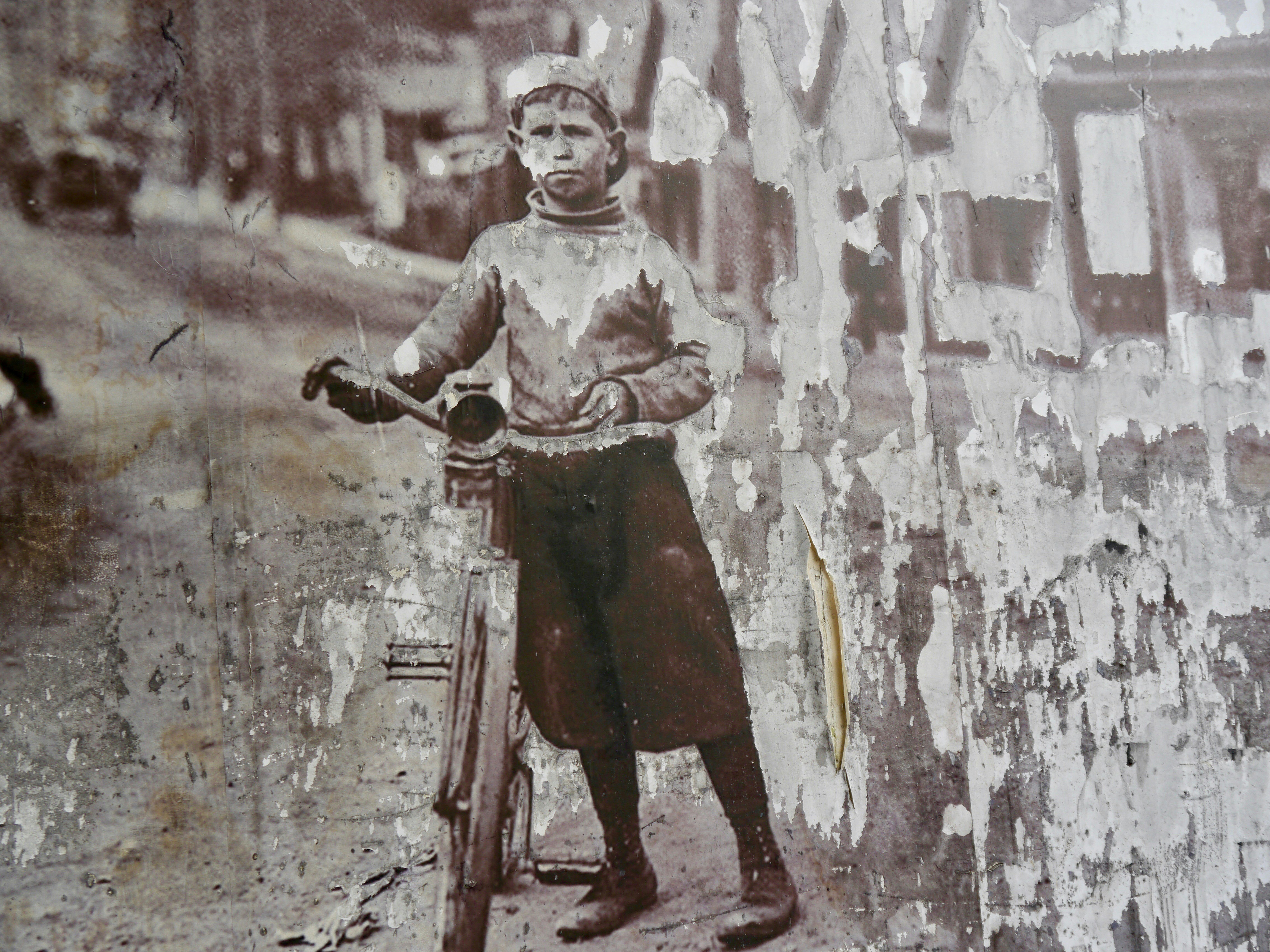 Man standing beside wall