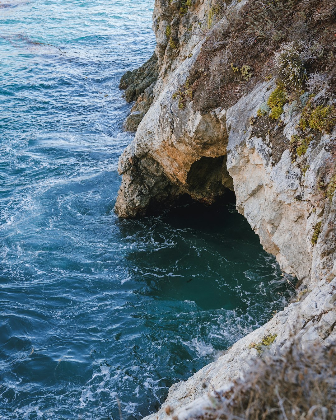 gray sea cliff during daytime