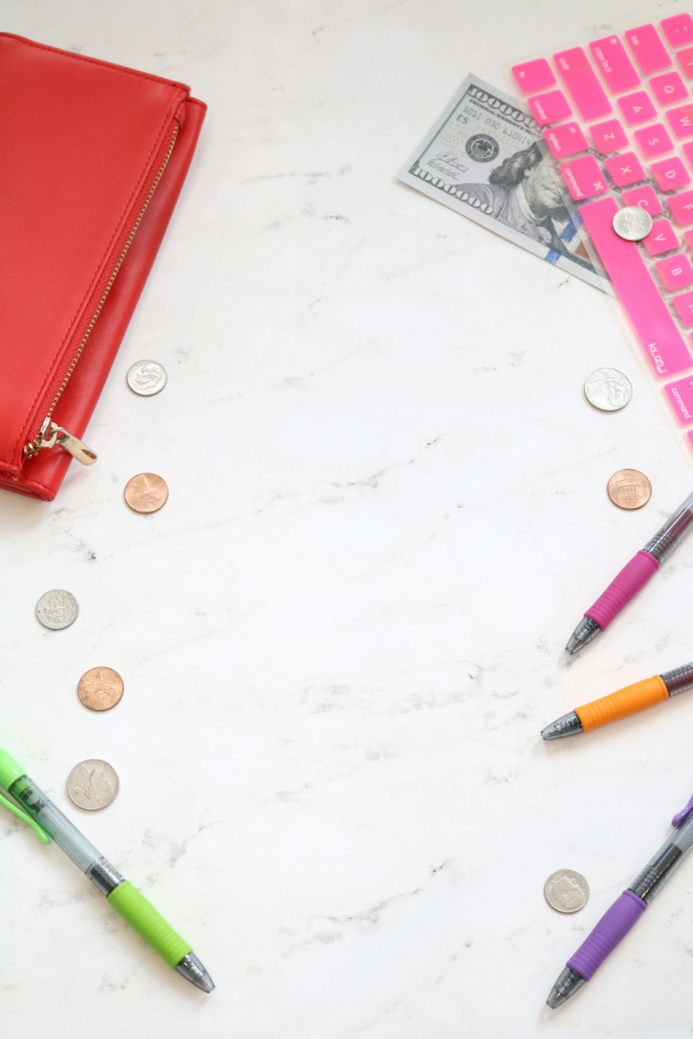 assorted-color pens on top of table