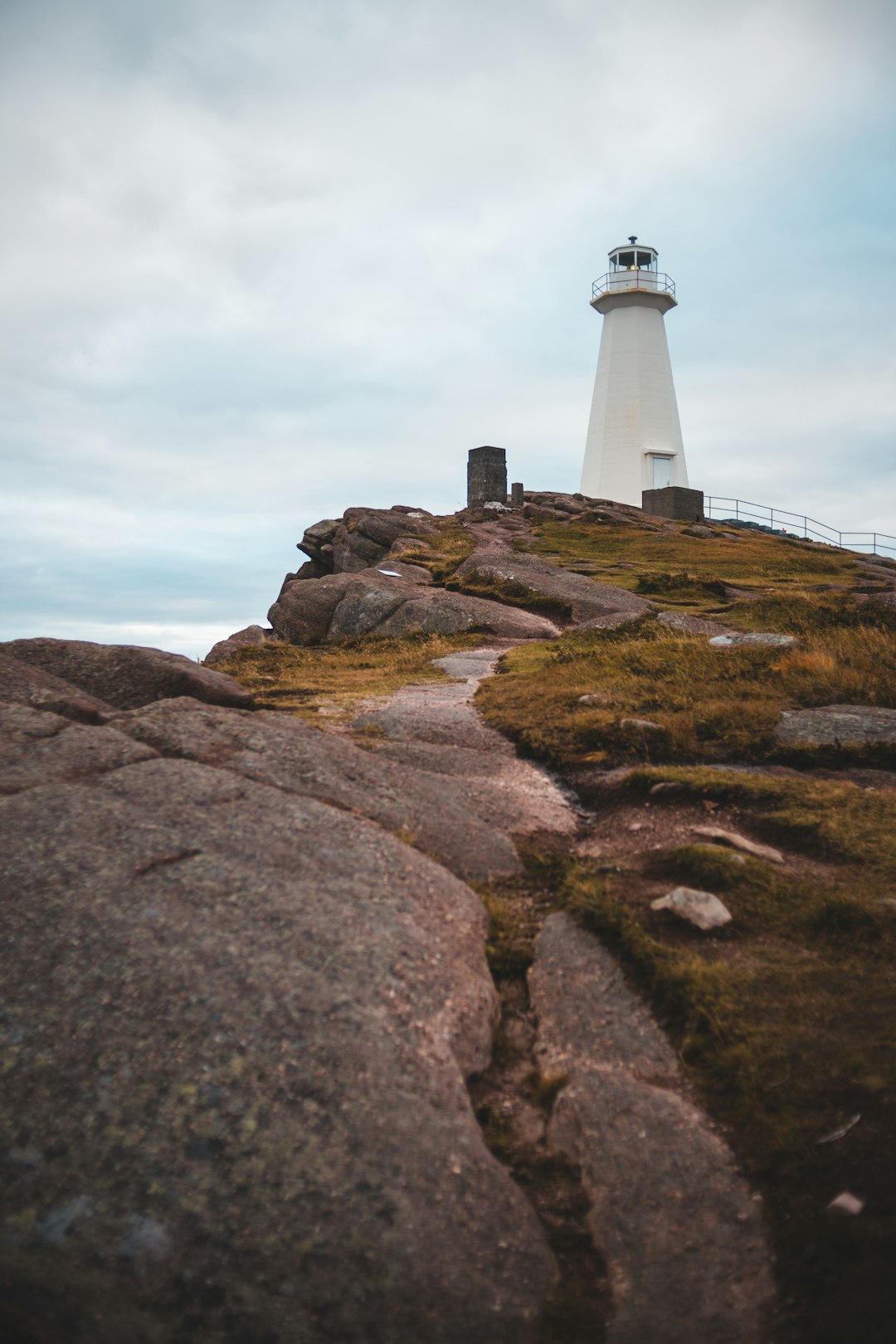 rock formation near lighthouse