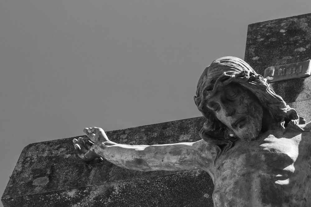 man hanged on cross