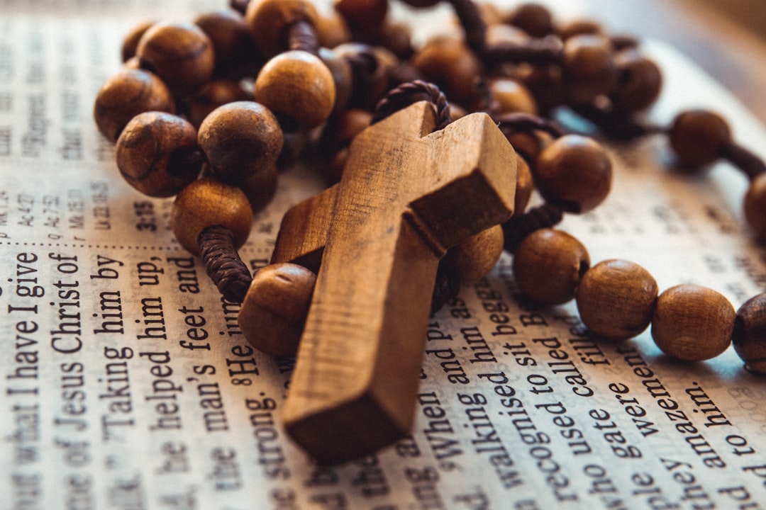 beaded brown rosary on open bible