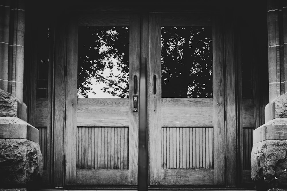 grayscale photo of a wooden double doors