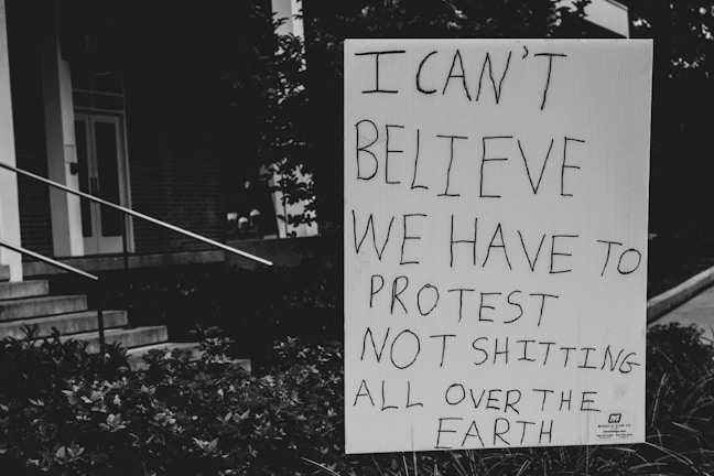 A punk-style protest sign with a witty slogan about everyday frustrations.