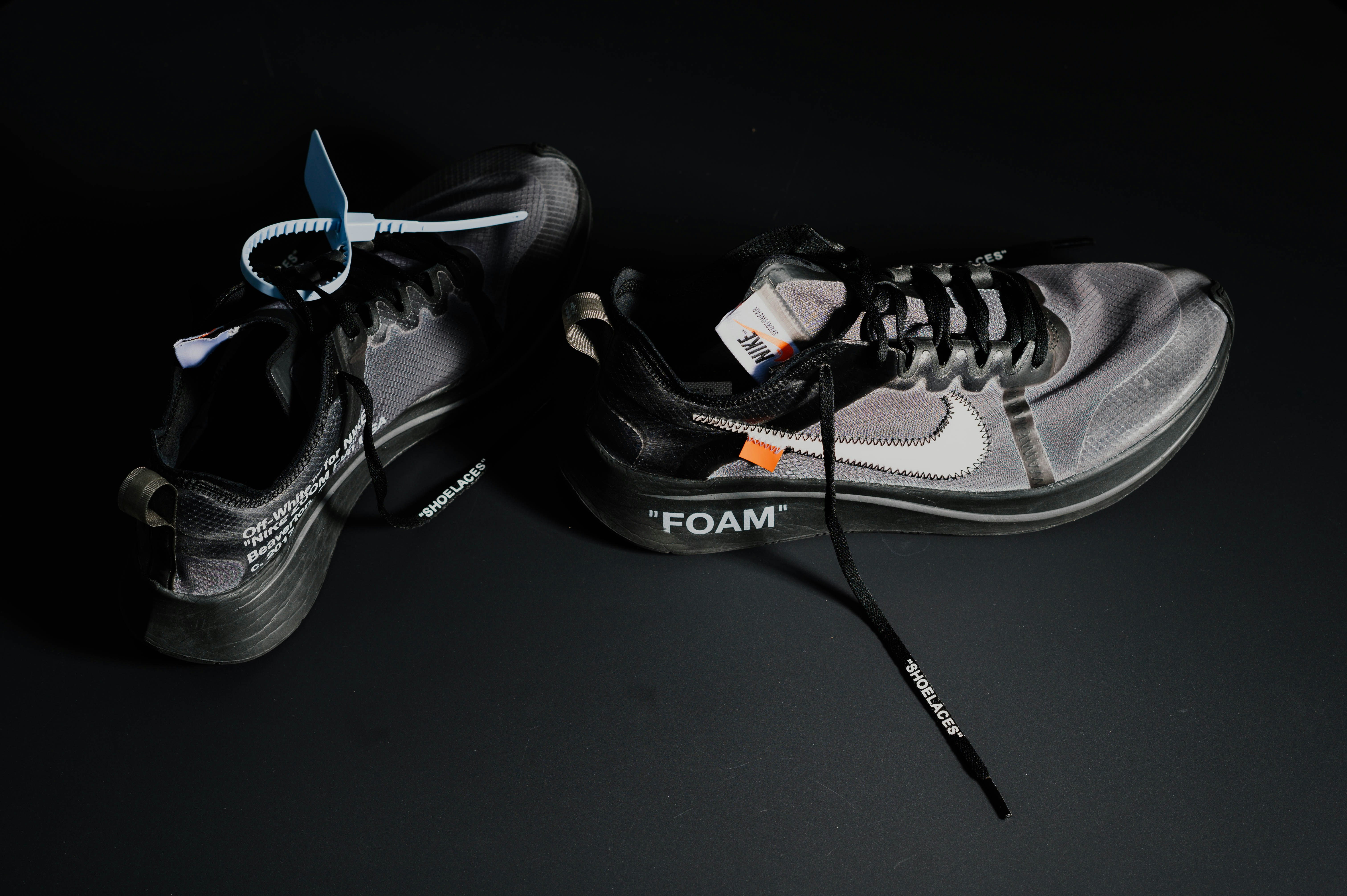 black and gray nike running shoes