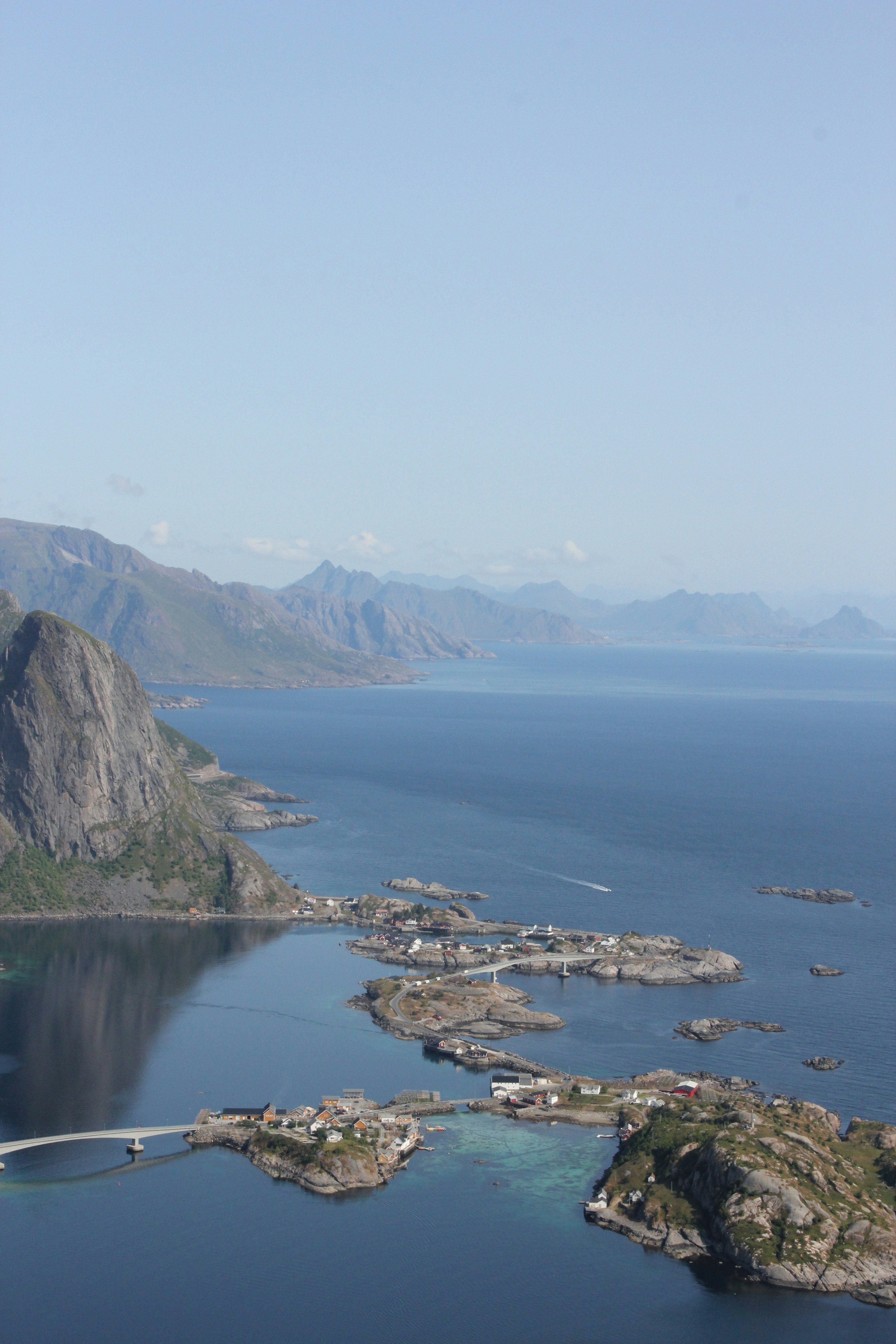 aerial photography of blue sea viewing mountain during daytime