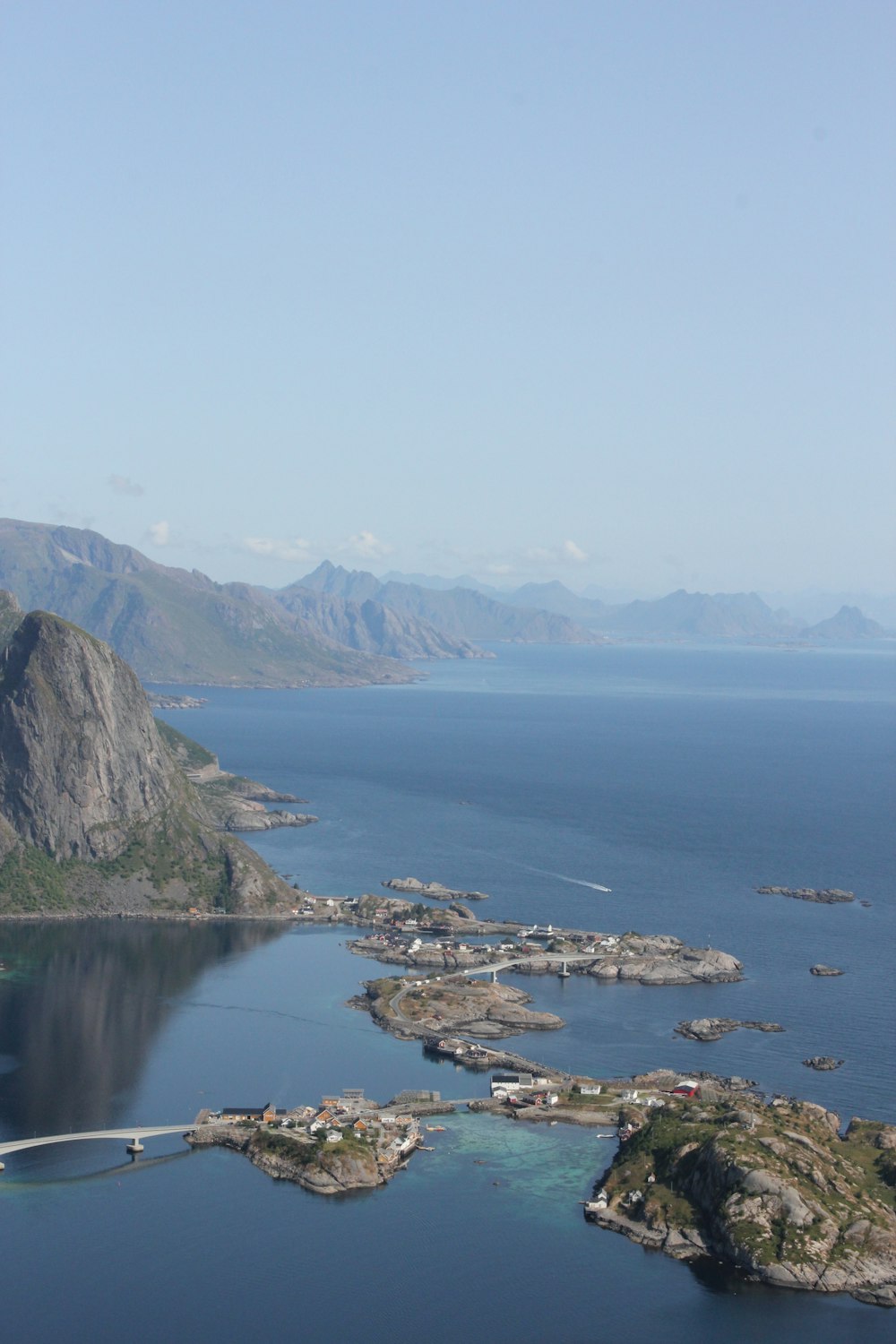 aerial photography of blue sea viewing mountain during daytime