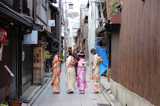 four women wearing geisha costumes at daytime