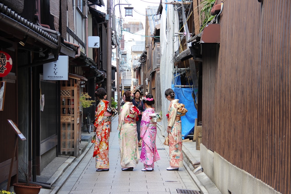 four women wearing geisha costumes at daytime