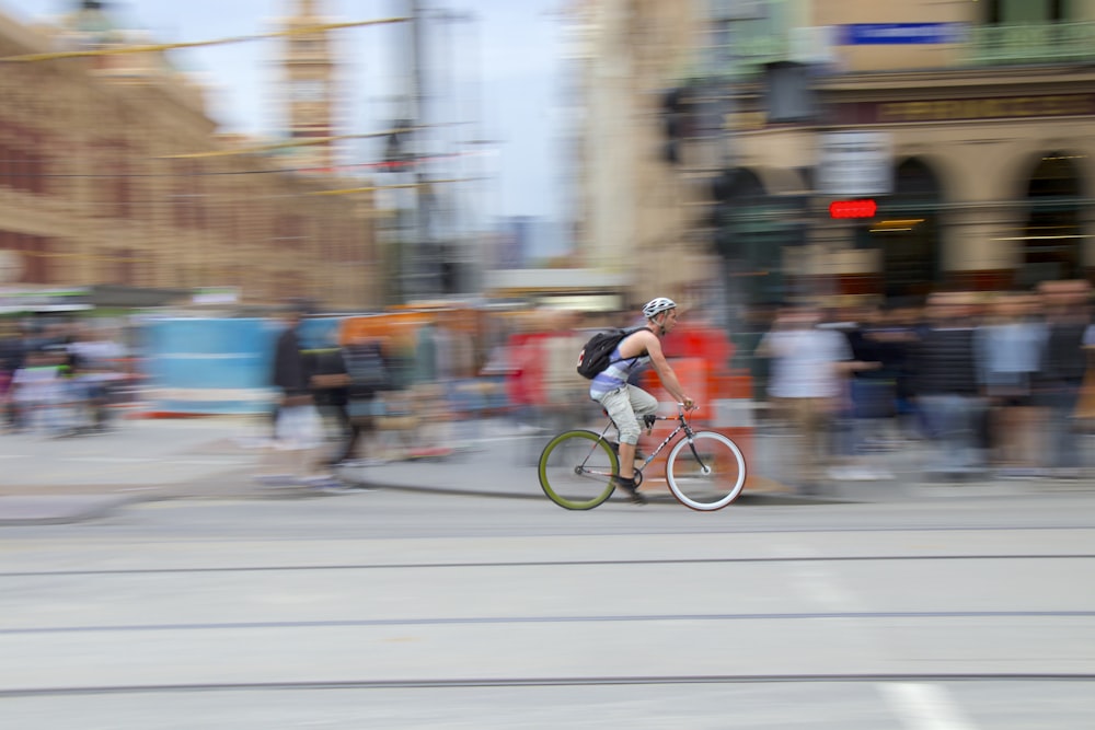 man riding vehicle on road at daytime