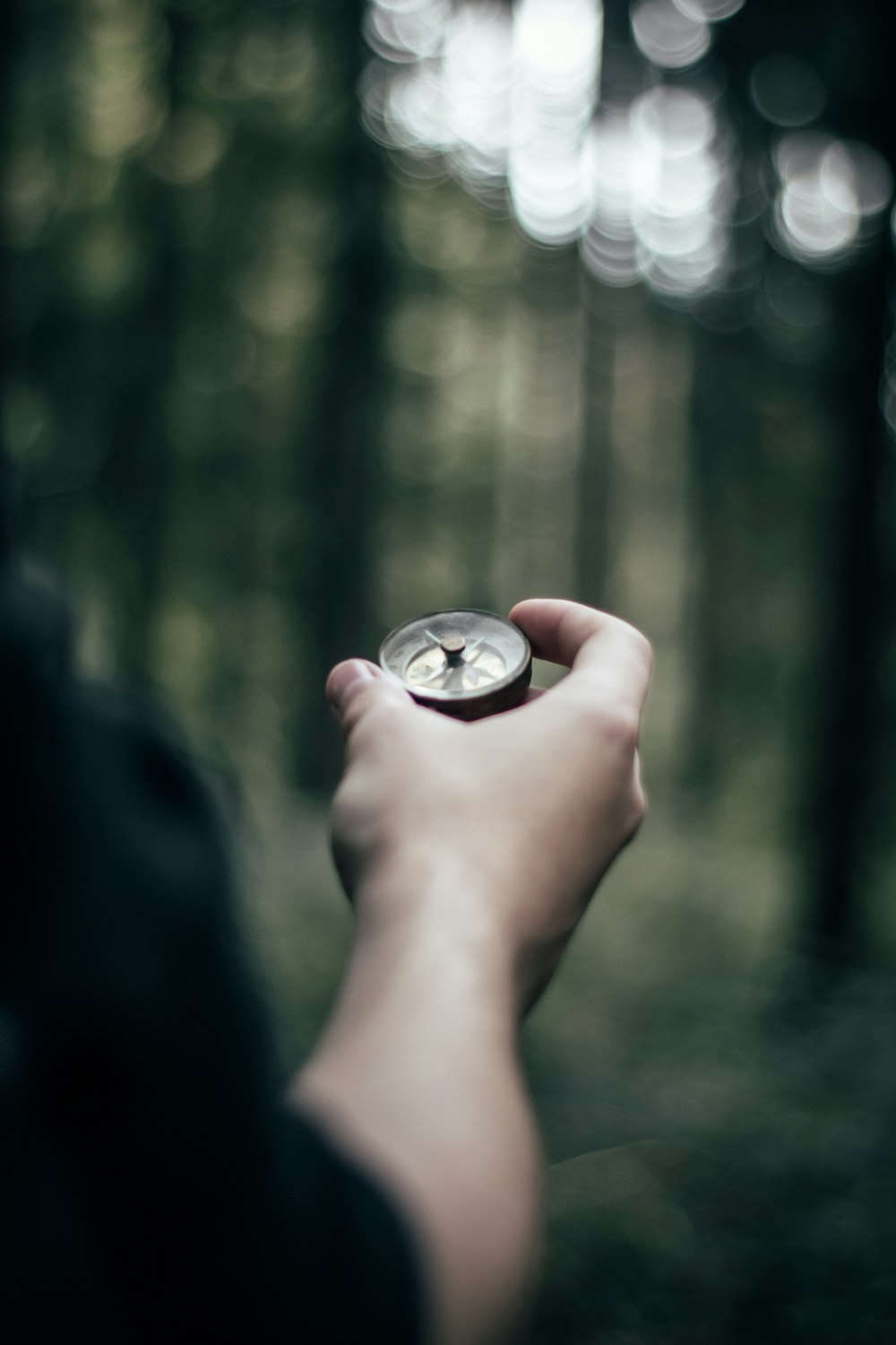 person holding compass