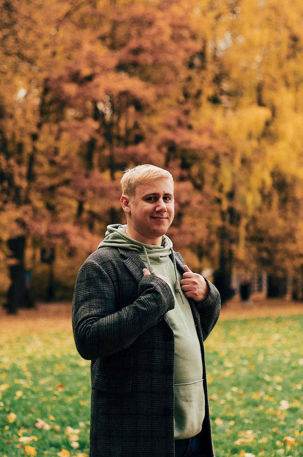 man standing on grass field at daytime