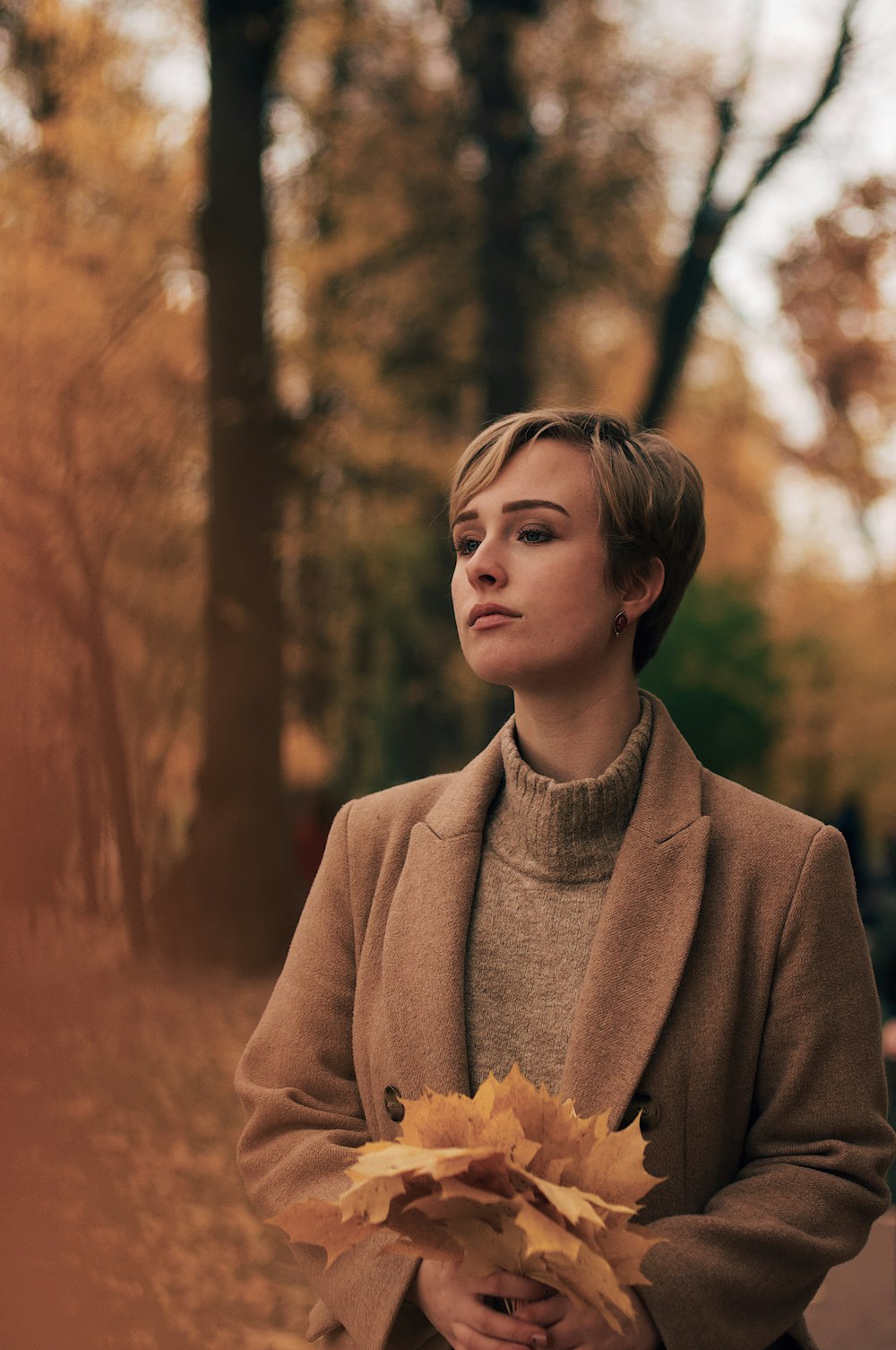 woman wearing brown coat