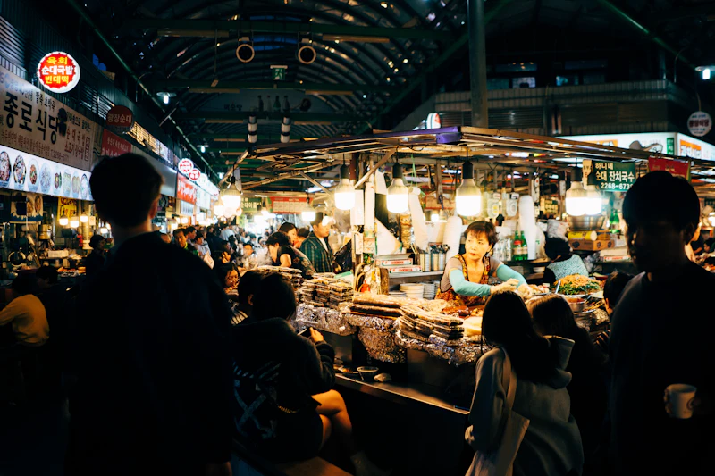 Vibrant Korean street market with colorful food stalls and lanterns