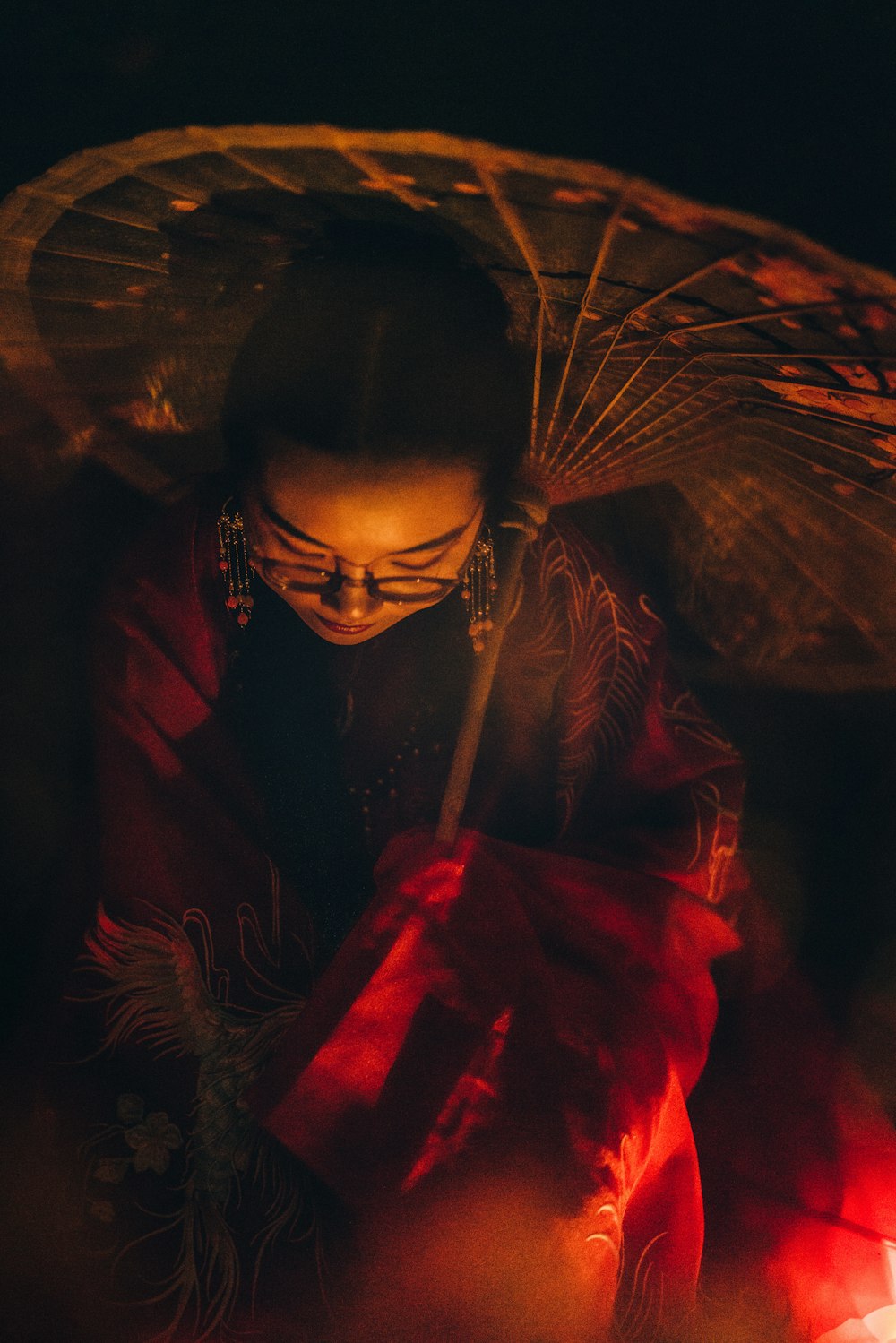 looking down woman holding umbrella