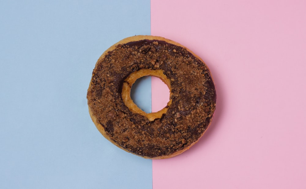 doughnut on pink and gray surface