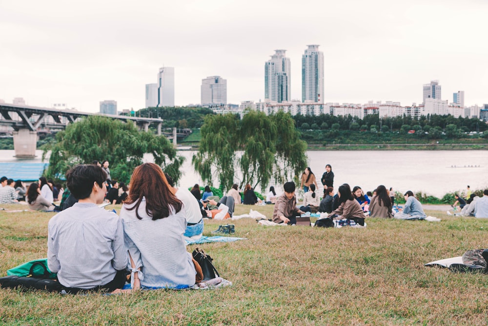 people in park near river