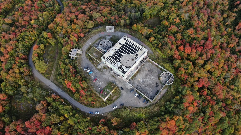 aerial photography of white concrete building surrounded by trees