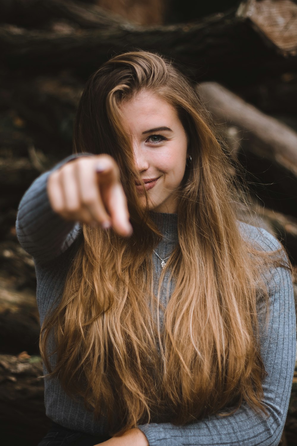 woman wears gray long-sleeved shirt