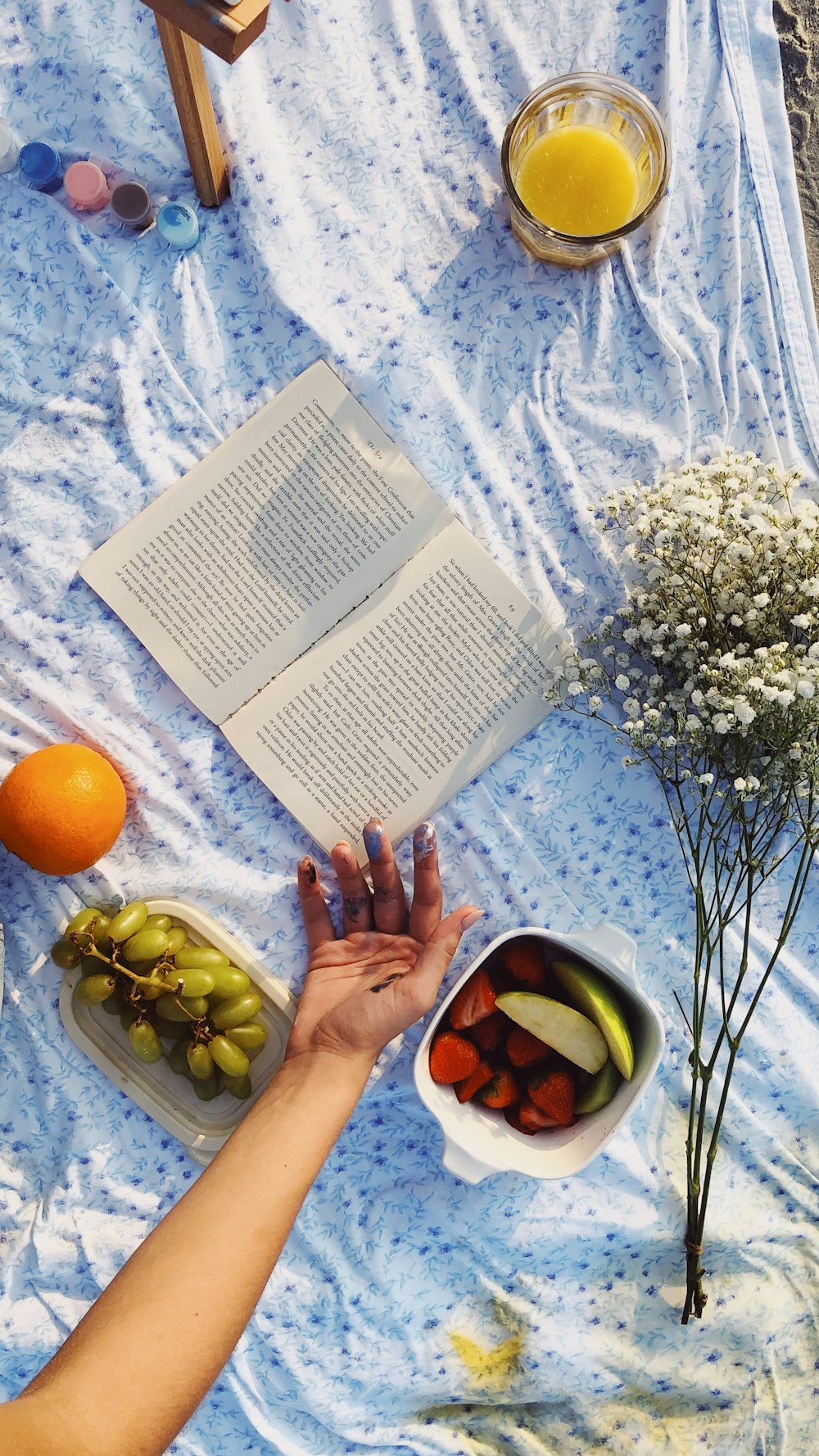 opened book beside flowers