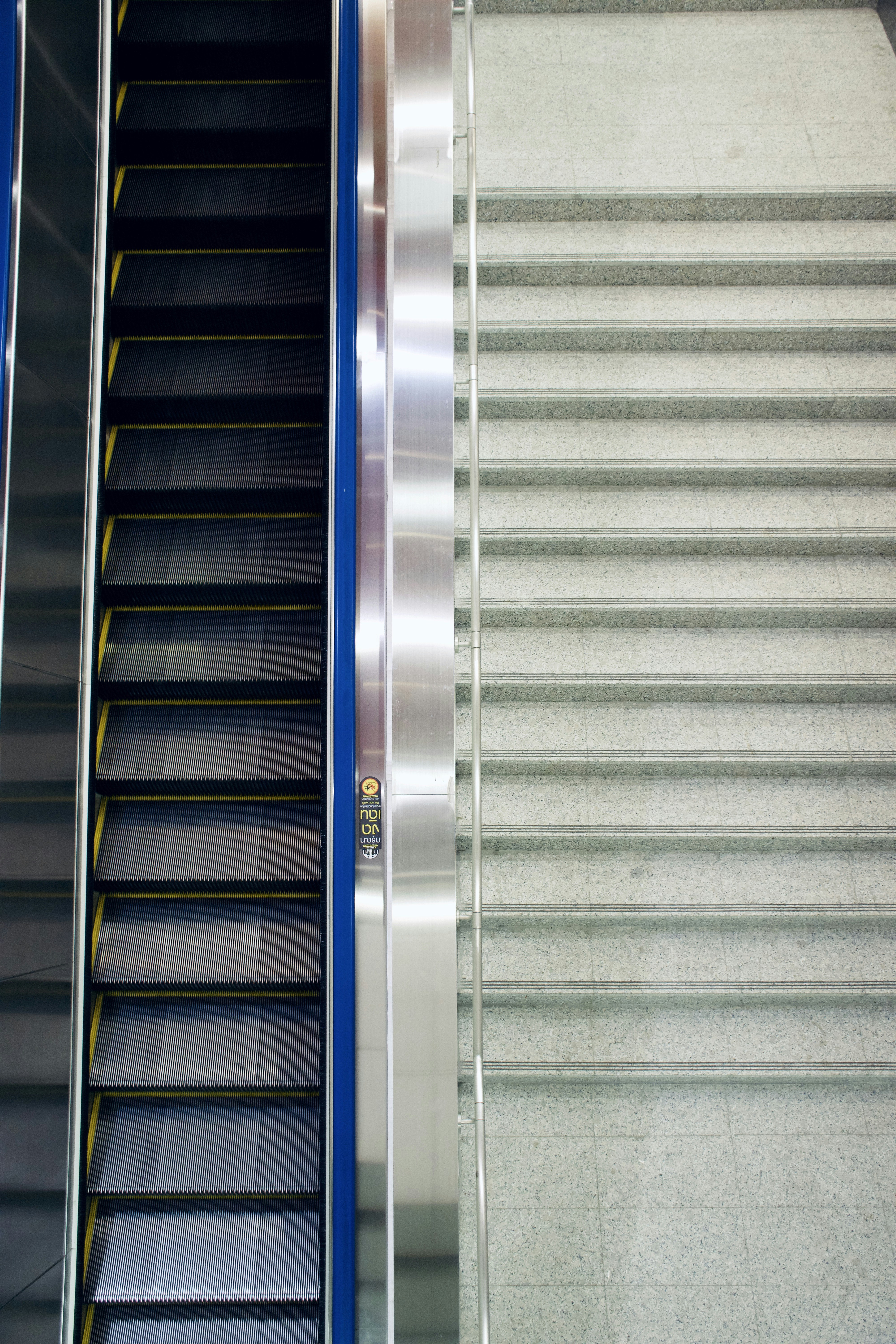 Black and gray stairs photo Free Escalator Image on Unsplash