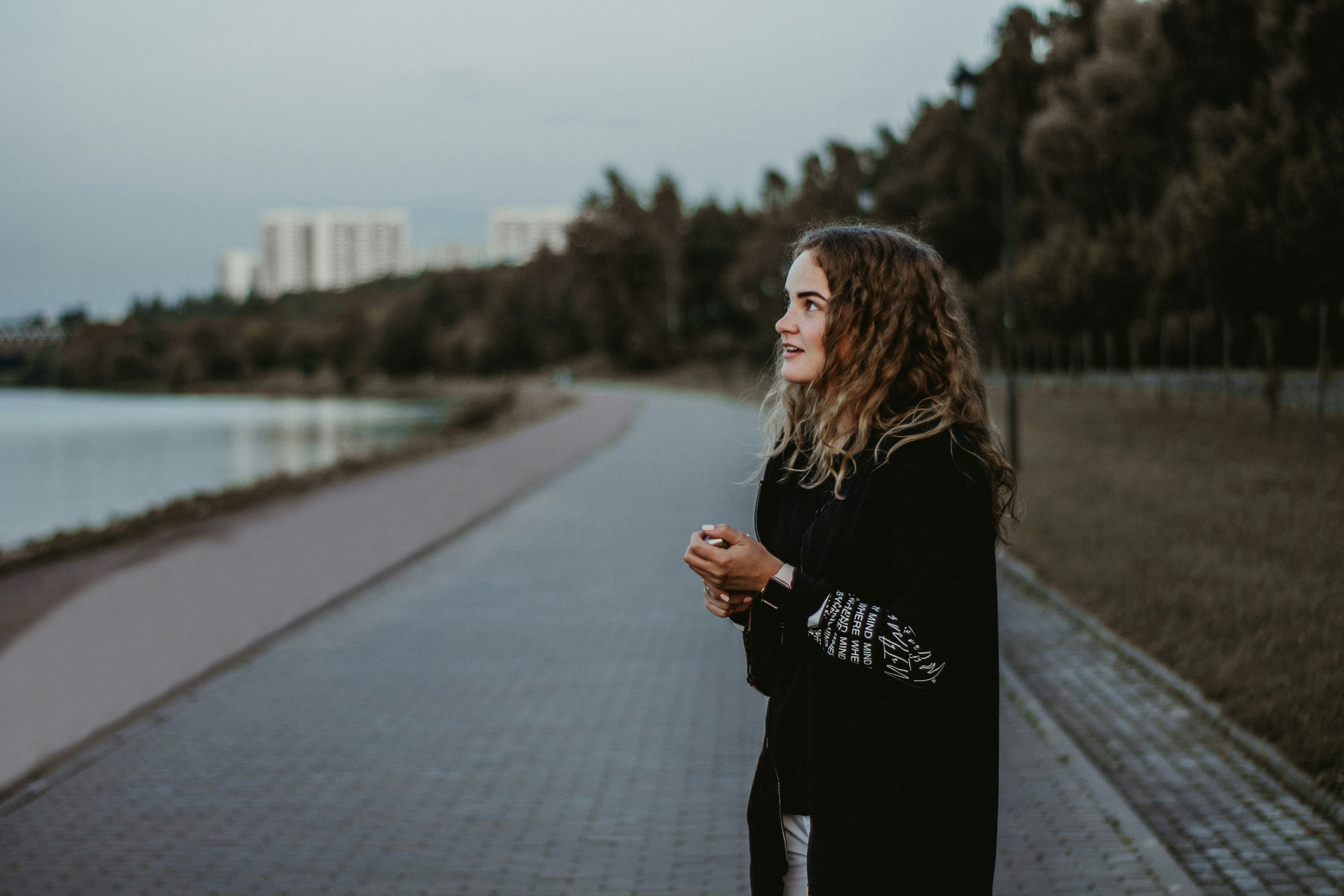 woman standing near body of water
