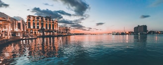 A scenic view of a waterfront property at sunset.