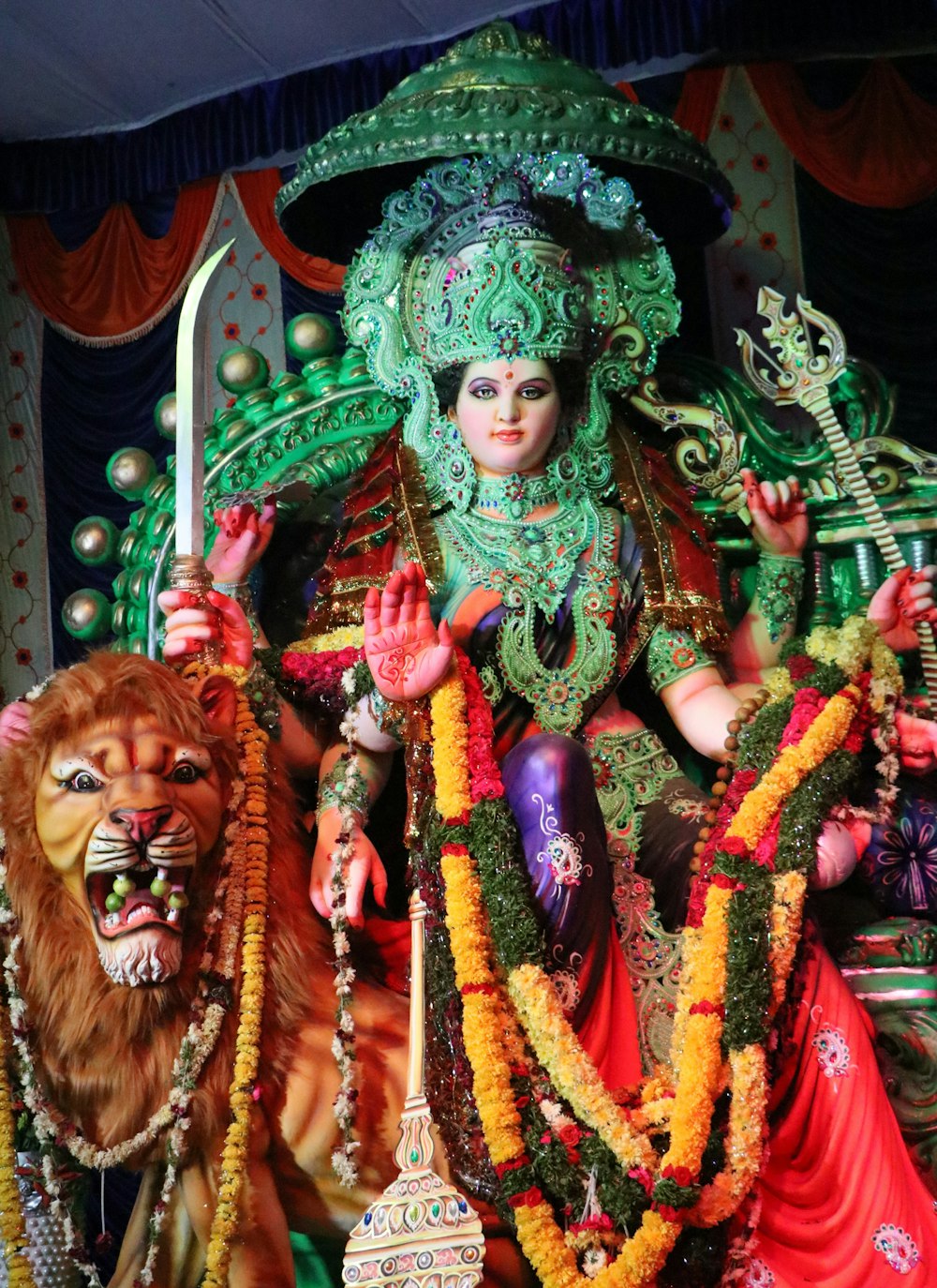 a statue of a hindu god with a lion